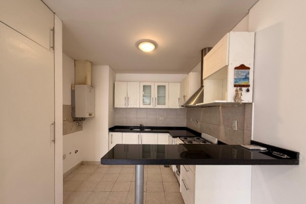 DEPARTAMENTO DOS DORMITORIOS CON COCHERA - EDIFICIO MELOS